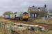 66416 passes the old station house at Forteviot with a Grangemouth - Aberdeen Intermodal working on 16 February. In the foreground is the site of the old SB.<br><br>[Bill Roberton 16/02/2007]