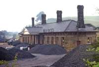 The 1862 station at Bakewell, on the one-time MR main line through the Peak District, had closed to passengers in March 1967 and to freight in July 1968. Four years after complete closure, the station forecourt was suffering the ignominy of use as a coal merchant's yard.<br><br>[Bill Jamieson 21/07/1972]