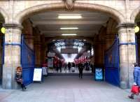 The grand entrance to Marylebone Station in November 2012. The lady on the left appears to be happy taking up 50% of the available seating - though it doesn't look very comfortable to me.<br><br>[Ken Strachan 09/11/2012]