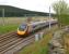 A northbound Pendolino passes Beattock Summit and the road traffic on the M74 behind it (in more ways than one!) on 03 June 2013.<br><br>[John McIntyre 03/06/2013]