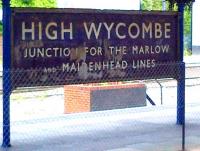 Amazing what you find when you take down a few old posters. Seriously outdated station sign at High Wycombe in April 2014. The connections to Marlow and Maidenhead were severed some 44 years ago.<br><br>[Ken Strachan 26/04/2014]