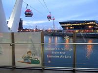Billy and the Snowdog feature in the bottom left of this view of the Emirates Air Line passing over the Royal Victoria Dock. The View looks south showing the route of the cable car over the dock, 'The Crystal', and the River Thames to Greenwich.<br><br>[John Yellowlees 30/11/2015]