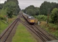 Bet the trees weren't that lush in steam days. But the class 31 in original butterscotch livery looks very 'sixties'. View looks North, from the road overbridge.<br><br>[Ken Strachan 10/09/2016]