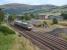 170427 passes the former Blackford station and goods yard on 23rd August 2017. There is little evidence of the planned Highland Spring terminal yet.<br>
<br><br>[Bill Roberton 23/08/2017]