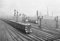 The 10am Glasgow Central-London ^The Royal Scot^ being hauled by 10202 and 10201 passing Polmadie on the 27th of April 1957. Although a grainy image Dixons Blazes^ coke ovens can still be observed. Polmadie bridge was a favourite gathering point for many Glasgow youngsters in those earlier years. (Photo taken by Graham Ewing and permission given to submit.)