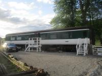 <h4><a href='/locations/R/Rogart'>Rogart</a></h4><p><small><a href='/companies/S/Sutherland_Railway'>Sutherland Railway</a></small></p><p>Former railway coach converted into overnight accommodation at Rogart on the Far North of Scotland Line, seen here on the evening of Sunday, 16th June 2019.   This is where Paul and I stayed for one night only before going on to Thurso and Wick the following day and then back to Alness in the evening.   I had never stayed in an old railway coach before and it was a most interesting and enjoyable experience that I can thoroughly recommend.   Anybody else wishing to enjoy a stay here can do so by contacting www.sleeperzz.com (and I have not been paid by the owners to say that.) 34/44</p><p>16/06/2019<br><small><a href='/contributors/David_Bosher'>David Bosher</a></small></p>