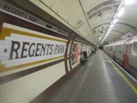 <h4><a href='/locations/R/Regents_Park'>Regents Park</a></h4><p><small><a href='/companies/B/Baker_Street_and_Waterloo_Railway'>Baker Street and Waterloo Railway</a></small></p><p>Currently the oldest trains on the Underground, and looking well past their sell-by date, a train of 1972 Bakerloo Line stock arrives at Regent's Park with a service from Elephant & Castle to Queens Park, on 11th February 2023. The painted tile wall name, dating from opening in 1906 but covered by advertising hoarding for many years, is incorrectly spelt with no apostrophe between the 't' and the 's'.   All other signs here have the correct spelling. 11/11</p><p>11/02/2023<br><small><a href='/contributors/David_Bosher'>David Bosher</a></small></p>