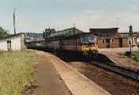 Class 47 hauled passenger train stopped at Forres station. View looks east.<br><br>[Ewan Crawford //]
