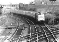 A Deltic brings train 1S17, the thirteen coach down Flying Scotsman, effortlessly past Portobello East Junction in October 1972. The bridge and embankment in the background carried the Lothian Lines over the ECML.<br><br>[John Furnevel 30/10/1972]