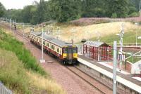 Two stops out from its destination at Larkhall, a train from Dalmuir arrives at Chatelherault on 14 August 2006.<br><br>[John Furnevel 14/08/2006]