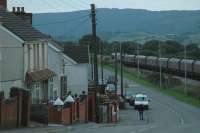 Coal in the valleys; as it grows dark a loaded coal train runs downhill through Tynewdd from Onllwyn.<br><br>[Ewan Crawford 13/09/2006]