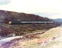 47517 on its way south from Dalwhinnie to Drumochter Summit, with the 1230 Inverness to Edinburgh.<br><br>[Brian Forbes /04/1983]