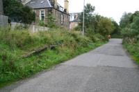 Looking along the trackbed and platform remains at Merchiston station on 5 October 2006. View is east towards the former Princes Street station. This section of the old route now serves as the eastern access to Slateford Yard (behind the camera). The road entry from Harrison Gardens is to the right where the JCB is parked.  <br><br>[John Furnevel 05/10/2006]