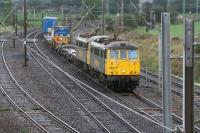 The usual suspects passing the Quintinshill loops on 12 October 2006 with the lightly loaded morning Basford Hall - Coatbridge Freightliner service.<br><br>[John Furnevel 12/10/2006]