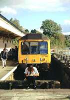 DMU showing Skegness (!) on the destination blind stands in the Looe branch platform at Liskeard in the early 1990s, with the guard having a break between duties.<br><br>[Ian Dinmore //]