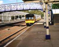 Merseyrail class 142 on its way home heads south through Dumfries in September 2006 after a works visit.<br><br>[John McIntyre 22/09/2006]