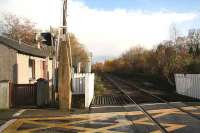 Looking east from the level crossing at Oyne over the site of the former station in 2006.<br><br>[John Furnevel 08/11/2006]
