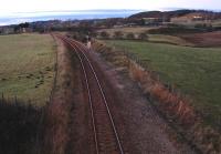 Work begins on the Raiths Farm development (new depot to replace Guild Street) with the cabling being moved to the east side of the lifted track to allow vehicles to drive up the trackbed. View looks north from the site.<br><br>[Ewan Crawford 27/01/2007]