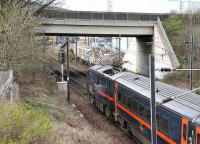 Down GNER train restarting from a red at Portobello Junction in March 2007. The bridge now carries the Portobello bypass. Its predecessor carried the Lothian Lines across the ECML, around Portobello Yards and on to Leith Docks. <br><br>[John Furnevel 21/03/2007]