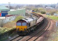 A ballast train joins the sub at Niddrie West off the Millerhill line on 31 March with 66085 at the front and 66191 bringing up the rear.<br><br>[John Furnevel 31/03/2007]
