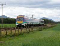 170 403 in Scotrail colours heads for Cupar, about to pass Bow Of Fife L.C. The peaks are East(L) & West(R) Lomond Hills.<br><br>[Brian Forbes 28/05/2007]