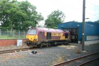 EWS 67004 <I>Post Haste</I> standing outside the wheel lathe shed at Craigentinny depot on 5 July 2007. Photographed from a passing train.<br><br>[John Furnevel 05/07/2007]