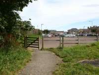 The trackbed of the North Sunderland Light Railway entering the former terminus at Seahouses in the summer of 2007. The site, that once accommodated the station, goods yard and locomotive shed, is now the main car park for the village. [See image 16293]<br><br>[John Furnevel 18/08/2007]