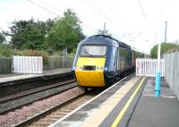 HST heads south on the ECML through Chathill on 16 August. Behind the fence on the right was a bay platform serving the North Sunderland Light Railway running to Seahouses on the coast. <br><br>[John Furnevel 16/08/2007]