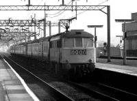 A class 86 takes a northbound express through Watford Junction on 20 March 1976.<br><br>[John McIntyre 20/03/1976]