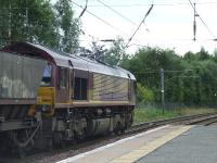 66164 passing through Johnstone heading west in the direction of Hunterston for more coal<br><br>[Graham Morgan 30/08/2007]
