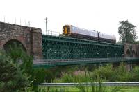 The 10.39 service from Inverness to the far north crosses the Oykel Viaduct towards Invershin station in August 2007. Note the pedestrian walkway attached to the side of the viaduct [see image 3272].<br><br>[John Furnevel 30/08/2007]