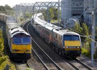 60029 brings the empty <I>Binliner</I> out of the landfill sidings at Oxwellmains on 19 September as a GNER Kings Cross - Edinburgh service passes on the ECML. <br><br>[Bill Roberton 19/9/2007]