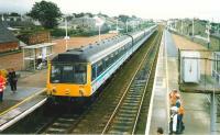 A 6-car 117 set about to head south ecs from Carnoustie during the 1999 <I>Open</I>. <br><br>[David Panton 17/07/1999]