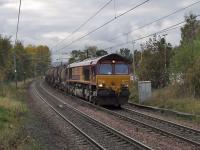 66221 passing through Johnstone with Irvine to Bescot empty china clay tanks<br><br>[Graham Morgan 18/10/2007]