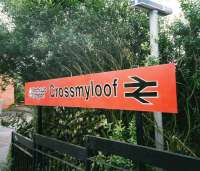 Station nameboard at Crossmyloof in July 1998. <I>Strathclyde Red</I> (clearly orange) in all its glory.<br><br>[David Panton /07/1998]