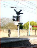 Interesting looking signal with various supplementary attachments standing on the northbound platform at Morpeth station on 8 November 2007. The white printed sign reads <I>Electric trains No access to South East Curve</I>.<br><br>[John Furnevel 08/11/2007]