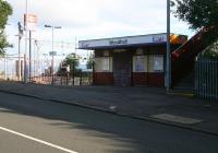 Entrance to Woodhall station on the east side of Port Glasgow. View northwest across Glasgow Road (and the Clyde beyond) on Sunday 29 July 2007. <br><br>[John Furnevel 29/07/2007]