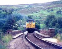 Northbound train crossing the Oykel Viaduct over the Kyle of Sutherland in 1977 on the approach to Invershin station.<br><br>[Ian Dinmore //1977]