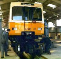 Prototype Metro car 4002 receiving attention at the Metro test track at Middle Engine Lane, North Tyneside in 1977. This facility later became the <I>Stephenson Railway Museum.</I> <br><br>[Colin Alexander //1977]