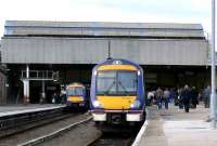 Busy Perth on 14 March with the 1355 to Inverness boarding in platform 4 and 170430 on the right bound for Edinburgh.<br><br>[Brian Forbes 14/03/2007]