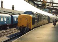 Deltic 55002 <I>The Kings Own Yorkshire Light Infantry</I> brings a <I>Merrymaker</I> excursion from Newcastle into Whitby on 2 August 1981. A DMU on an Esk Valley service stands at the other platform. <br><br>[Colin Alexander 02/08/1981]