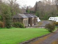 Chatburn has been closed since 1962 but the main station building survives in connection with a caravan storage park and is seen here from the approach road. <br><br>[Mark Bartlett 30/04/2008]