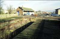 Looking east from the remaining short sections of platform to the goods shed at Milnathort.<br><br>[Ewan Crawford 1X/02/1999]
