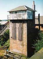 The exceptionally tall signal box at Plean Junction, photographed looking southwest from an overbridge in September 1999.<br><br>[David Panton /09/1999]