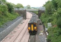 A Glasgow - Carlisle service runs east along the single line section towards Gretna shortly after leaving Annan on 21 May 2008 alongside recently laid track that will eventually form the new up line. The train is about to pass the bridge that carried the Solway Junction Railway from Annan Shawhill south to the Solway Viaduct. Nowadays the bridge is spanned by a waste-water pipeline linking the decommissioned nuclear power station at Chapelcross with the Solway Firth.     <br><br>[John Furnevel 21/05/2008]