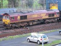 EWS 66183 passing the Craigentinny wheel lathe on 6 January 2007 with a load of imported coal off the branch from Leith Docks destined for Cockenzie power station.<br><br>[Mark Poustie 06/01/2007]