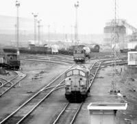 Looking south over Millerhill down yard in April 1980, with Monktonhall Colliery coal loading facility in the right background.<br><br>[John Furnevel 22/04/1980]
