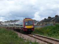 On the new Alloa line 170476 passes Waterside LC heading for Stirling and Glasgow Queen Street.<br><br>[Brian Forbes /08/2008]
