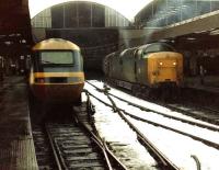 Twas Christmas Eve 1981, train 1S12 05.50 Kings Cross-Aberdeen prepares to leave Newcastle Central behind York Deltic 55017 <I>The Durham Light Infantry</I>. With one week left in service 55017 still looks every inch the Gateshead locomotive she once was, i.e. filthy dirty.<br><br>[Colin Alexander 24/12/1981]