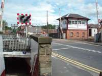 The L&Y signal box at Parbold, which still controls a mixture of semaphores and colour light signals protecting the block section and the level crossing. The subway under the line can also be seen in this view in August 2008. <br><br>[Mark Bartlett 13/08/2008]